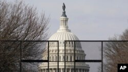 Security surrounds the U.S. Capitol in Washington, Friday, Jan. 15, 2021, ahead of the inauguration of President-elect Joe Biden and Vice President-elect Kamala Harris. (AP Photo/Susan Walsh)