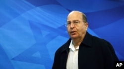FILE - Israeli Defense Minister Moshe Ya'alon arrives at the weekly cabinet meeting at the prime minister's Jerusalem office.