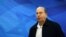 FILE - Israeli Defense Minister Moshe Yaalon arrives at the weekly cabinet meeting at the prime minister's Jerusalem office.