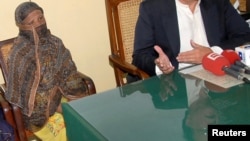 FILE - Pakistani Christian woman Asia Bibi is seen after a meeting with the governor of the Punjab Province at a jail in Sheikhupura, Pakistan.