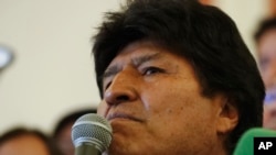 Bolivian President Evo Morales speaks to supporters at the presidential palace in La Paz, Bolivia, after a first round presidential election, Sunday, Oct. 20, 2019.