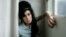 FILE - In this 2007 file photo, British singer Amy Winehouse poses for photographs after being interviewed by The Associated Press at a studio in north London.