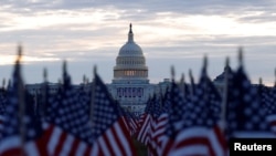 Thousands of U.S. flags are seen at the National Mall near the Capitol, ahead of President-elect Joe Biden's inauguration, in Washington, Jan. 18, 2021. 