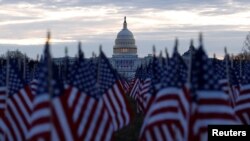 Thousands of U.S. flags are seen at the National Mall near the Capitol, ahead of Joe Biden's inauguration as president, in Washington, Jan. 18, 2021. 