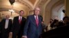 FILE - Senate Majority Leader Mitch McConnell, R-Ky., Sen. James Inhofe, R-Okla., a member of the Senate Armed Services Committee (far-L) and Sen. John Barrasso, R-Wyo., (2nd-L) arrive for a news conference on Capitol Hill in Washington, June 12, 2018.