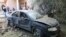 A damaged car is seen during clashes between rival factions in Tripoli, Libya, Aug. 30, 2018. 