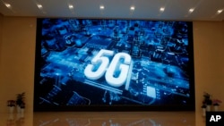 A 5G logo is displayed at the Huawei campus in Shenzhen city, China, March 6, 2019. Australia’s ban on Huawei’s involvement in its 5G networks and its crackdown on foreign covert interference are testing Beijing’s efforts to project its power overseas.