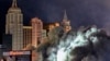 A dust cloud partially covers the New York-New York hotel-casino after the Tropicana Las Vegas towers were imploded, in Las Vegas, Oct. 9, 2024.