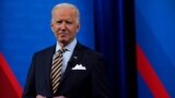 President Joe Biden stands on stage during a break in a televised town hall event at Pabst Theater, Tuesday, Feb. 16, 2021, in Milwaukee. (AP Photo/Evan Vucci)