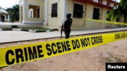 FILE - Police crime scene tape is seen in Owo, Ondo, Nigeria, June 6, 2022.