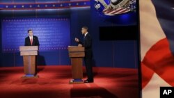 Republican presidential nominee Mitt Romney (l) debates President Barack Obama at the University of Denver, Oct. 3, 2012, in Denver