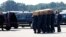 A coffin of one of the victims of Malaysia Airlines MH17 downed over rebel-held territory in eastern Ukraine, is loaded into a hearse on the tarmac during a national reception ceremony at Eindhoven airport July 23, 2014. Two aircraft carrying the remains 