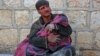 A Syrian man weeps as he cradles the body of his daughter who was killed following reported shelling in the town of Khan Sheikhun in the southern countryside of the rebel-held Idlib province. The government&#39;s bombardment near Khan Sheikhun, in Idlib province, also killed two civilians, raising the civilian death toll to 42 since February 9, according to the Britain-based Syrian Observatory for Human Rights.