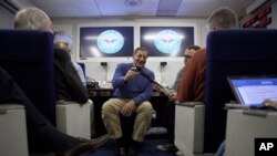 Defense Secretary Leon Panetta briefs the media on board a plane en route to a NATO conference in Brussels, Belgium, Feb. 1, 2012.
