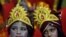Children dressed as Hindu Lord Krishna wait to participate in a fancy dress competition at a temple in Chandigarh, India.