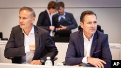 Oliver Blume, left, Chairman of the Board of Management of Volkswagen AG and Porsche AG, and Thomas Sch'fer, Member of the Board of Management of the Volkswagen brand, take part in a work meeting at the VW plant in Wolfsburg, Sept. 4, 2024.