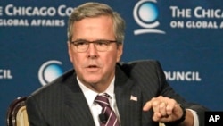 FILE - Former Florida governor Jeb Bush answers questions after speaking at the Chicago Council on Global Affairs, Feb. 18, 2015, in Chicago.