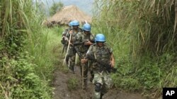 United Nations peacekeepers patrol near their encampment in the village of Kimua in the east of DRC.