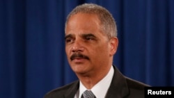 FILE - U.S. Attorney General Eric Holder makes a statement about the grand jury decision not to seek an indictment in the Staten Island death of Eric Garner during an arrest in July, in Washington, Dec. 3, 2014. 