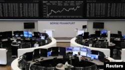 FILE - The German share price index DAX graph is pictured at the stock exchange in Frankfurt, Germany, July 10, 2020.