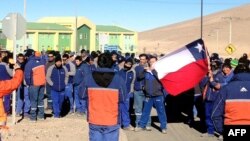 Workers at Escondida mine, owned by Australia-based BHP Billiton, protest outside mine compound, Antofagasta, Chile, August 14, 2013.