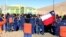 Workers at Escondida mine, owned by Australia-based BHP Billiton, protest outside mine compound, Antofagasta, Chile, Aug. 14, 2013.