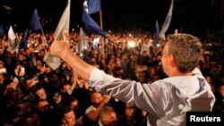 Kadri Veseli, the head of Democratic Party of Kosovo (PDK), greets the supporters of the coalition of the former Kosovo Liberation Army (KLA) commanders AAK, PDK and NISMA as they celebrate after first results of the Parliamentary elections in Pristina, Kosovo, June 12, 2017.