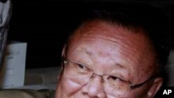 North Korean leader Kim Jong-il looks out from his car after meeting Russia's President Dmitry Medvedev in Siberia's Buryatia region, Aug. 24, 2011.