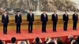 China's new Politburo Standing Committee members (L-R) Han Zheng, Wang Huning, Li Zhanshu, Xi Jinping, Li Keqiang, Wang Yang and Zhao Leji, line up as they meet with the press at the Great Hall of the People in Beijing, China October 25, 2017. 