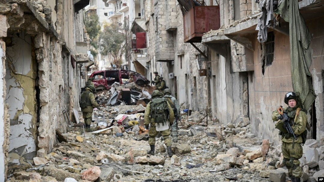 This undated handout photo released, Jan. 2, 2017, by the Russian Defense Ministry claims to show Russian military engineers operating in Aleppo, Syria.