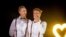 Australian Commonwealth Games sprinter Craig Burns, left, and fiance Luke Sullivan pose ahead of their marriage ceremony at Summergrove Estate, New South Wales, Jan. 8, 2018.