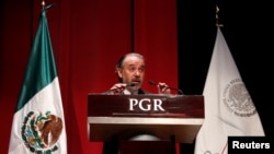 Attorney General Raul Cervantes speaks during a formal apology to three indigenous women who were wrongfully jailed for years, in Mexico City, Mexico Feb. 21, 2017.