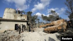 FILE - Turkish forces and Free Syrian Army members are seen on Mount Barsaya, northeast of Afrin, Syria Jan. 28, 2018. 