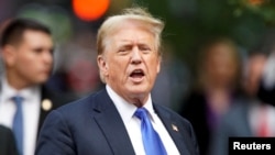 FILE - Former U.S. President Donald Trump walks outside Trump Tower in New York after the verdict in his criminal trial over hush money charges on May 30, 2024. Prosecutors in the case said on July 2 they would not fight Trump's request to delay sentencing in the felony case.