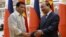 Philippines' President Rodrigo Duterte, left, greets Vietnamese Prime Minister Nguyen Xuan Phuc as they meet at Phuc's Cabinet Office in Hanoi, Vietnam, Sept. 29, 2016. Both nations are attempting to modernize their militaries.