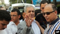 Hamdeen Sabahi waves to his supporters during protest against new judicial law in Cairo, May 25, 2013.