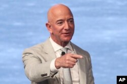 FILE - Amazon founder Jeff Bezos speaks during the JFK Space Summit at the John F. Kennedy Presidential Library in Boston, June 19, 2019.