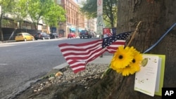 A small memorial to Portland, Oregon, fatal shooting victim Aaron J. Danielson, 39, of Portland is shown, Aug. 31, 2020, at the site where he was killed Aug. 29, 2020, as supporters of President Donald Trump and Black Lives Matter protesters clashed.