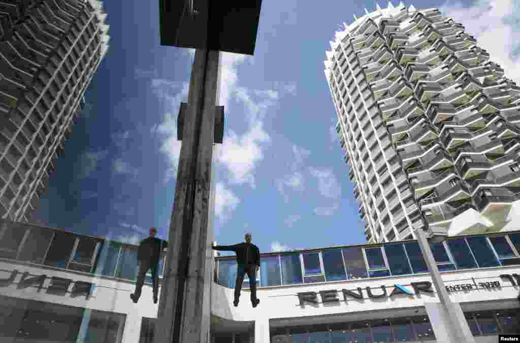 Israeli illusionist and endurance artist Hezi Dean performs a purported levitation trick in Tel Aviv. Dean began what he calls a &quot;24-hour levitation&quot; on the outside of a Tel Aviv building.