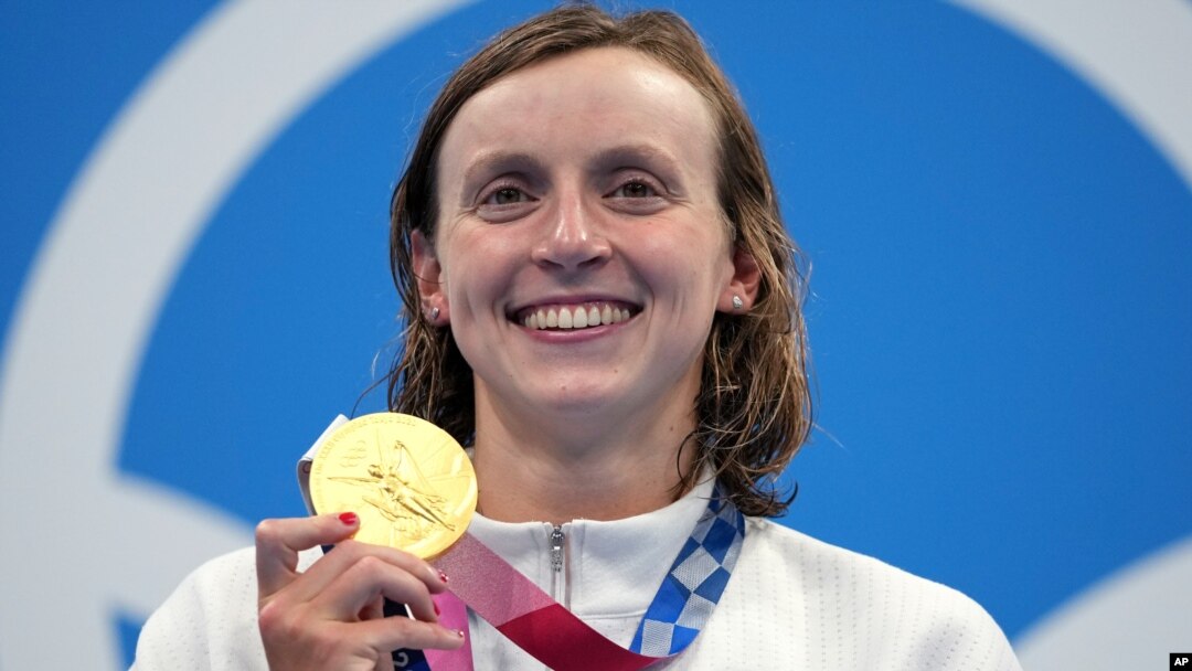 Katie Ledecky of the United States poses with her gold medal after winning the women's 1500-meters freestyle final at the 2020 Summer Olympics, July 28, 2021, in Tokyo, Japan. 