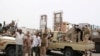 Members of UAE-backed southern Yemeni separatist forces shout slogans as they patrol a road during clashes with government forces in Aden, Yemen, Aug. 10, 2019. 