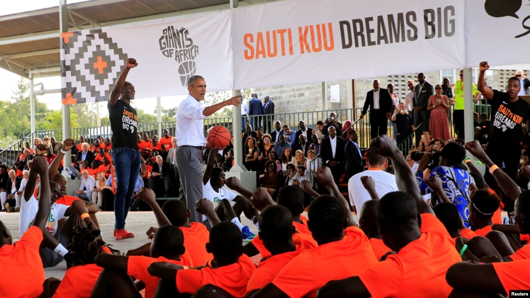 Former U.S. President Barack Obama addresses players at the basketball court during the launch of Sauti Kuu resource centre near his ancestral home in Nyangoma Kogelo village in Siaya county, western Kenya, July 16, 2018. 