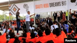 Former U.S. President Barack Obama addresses players at the basketball court during the launch of Sauti Kuu resource centre near his ancestral home in Nyangoma Kogelo village in Siaya county, western Kenya, July 16, 2018. 