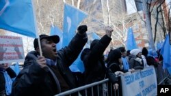 Uighurs and their supporters protest in front of the Permanent Mission of China to the United Nations in New York, March 15, 2018. Uighur Muslims protested a sweeping Chinese surveillance and security campaign that has sent thousands to detention camps.