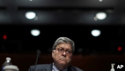 FILE - Attorney General William Barr listens during a House Judiciary Committee hearing on the oversight of the Department of Justice on Capitol Hill, July 28, 2020 in Washington.