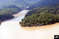 Marine One, with President Joe Biden on board, flies over Lake Lure and around areas affected by Hurricane Helene near Chimney Rock, N.C., Oct. 2, 2024.