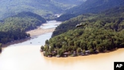 Marine One, with President Joe Biden on board, flies over Lake Lure and around areas affected by Hurricane Helene near Chimney Rock, N.C., Oct. 2, 2024.