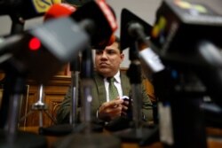 Lawmaker Luis Parra gives a press conference at the National Assembly in Caracas, Venezuela, Jan. 6, 2020.