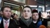 Moscow student Yegor Zhukov speaks to reporters after his trial in Moscow, Russia, Dec. 6, 2019. The court gave the blogger a three-year suspended sentence and banned him from administering websites for two years.