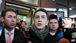 Moscow student Yegor Zhukov speaks to reporters after his trial in Moscow, Russia, Dec. 6, 2019. The court gave the blogger a three-year suspended sentence and banned him from administering websites for two years.